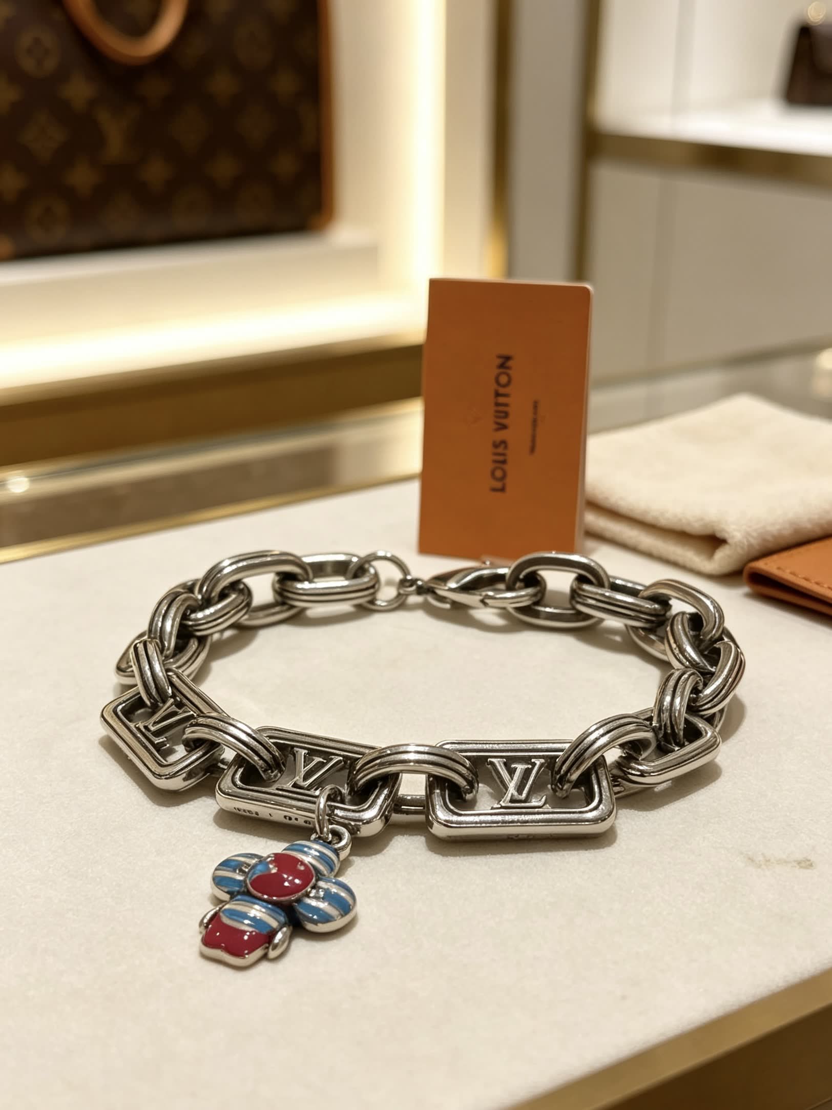 Louis Vuitton Silver Tone Bracelet with Monogram Charm